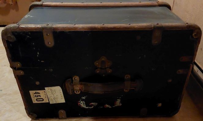 Old black wooden trunk with reinforcements