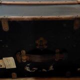 Old black wooden trunk with reinforcements
