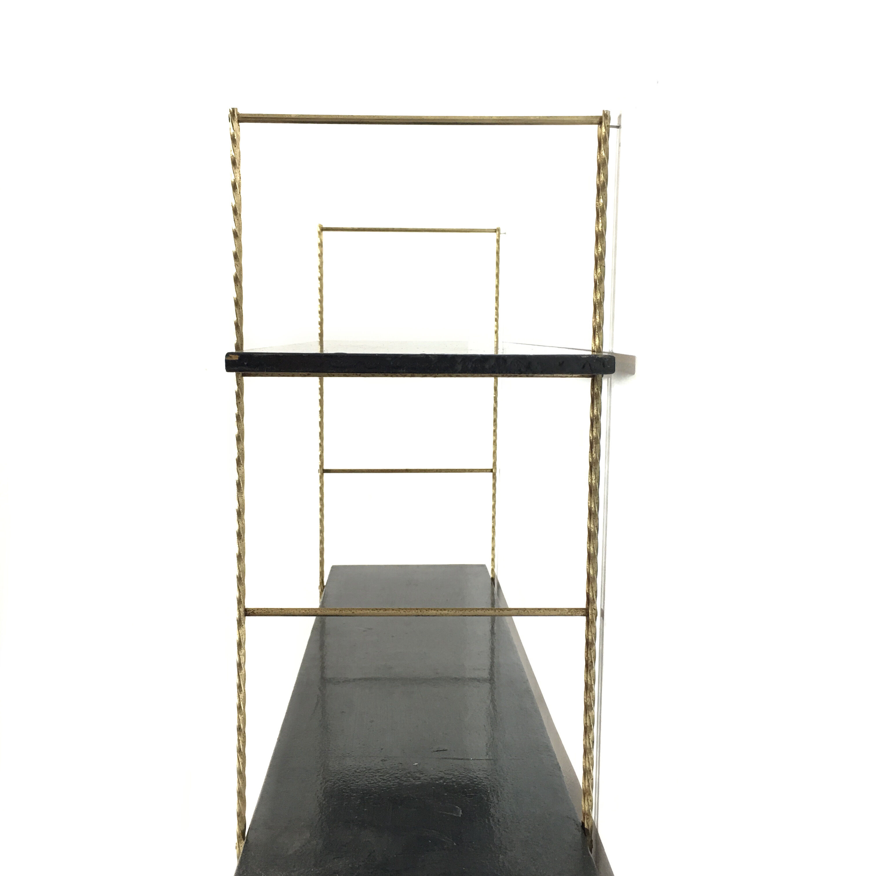 String gold metal shelf and black wood