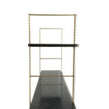 String gold metal shelf and black wood