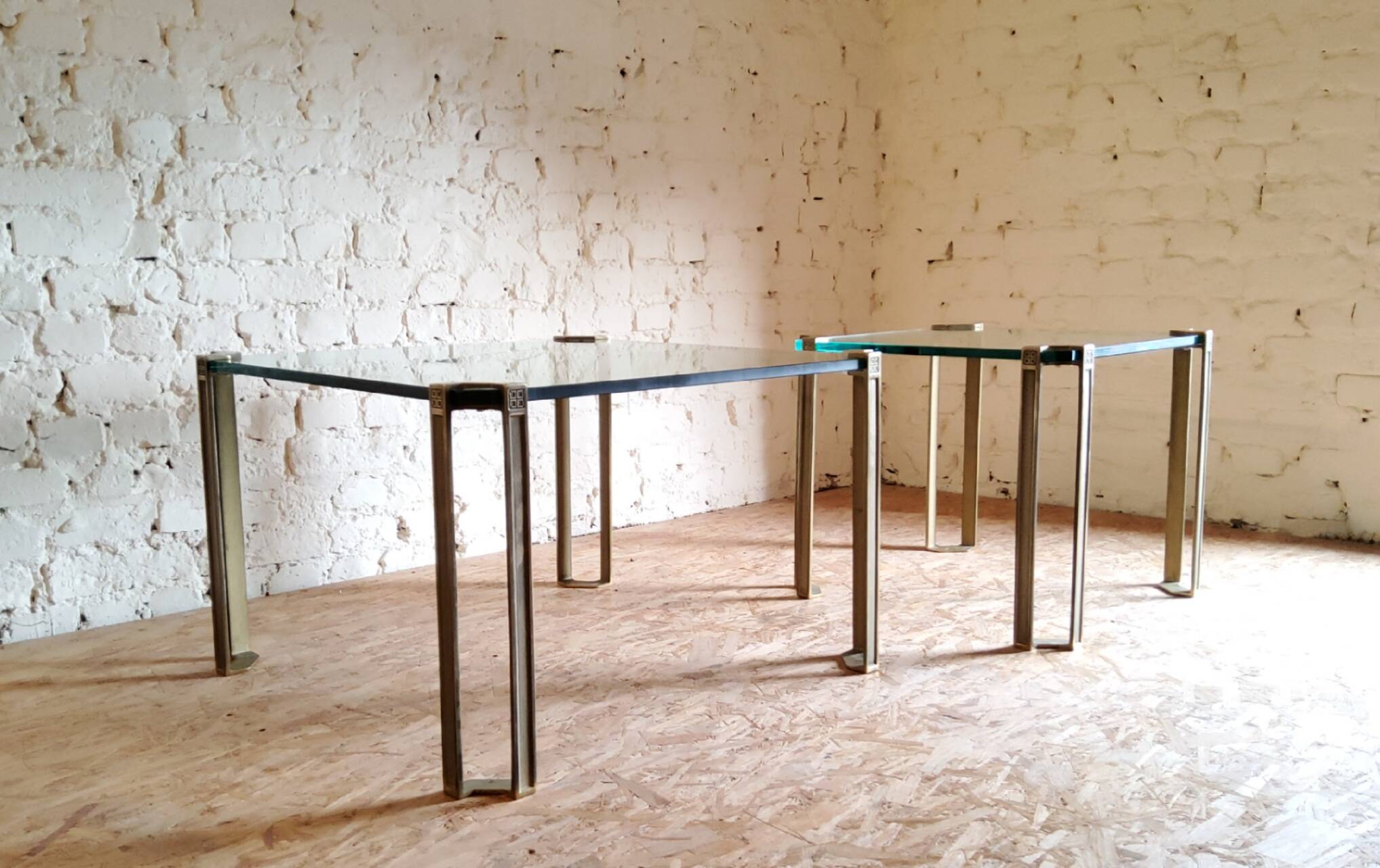 Glass and brass coffee tables by Peter Ghyczy