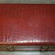 Crocodile leather and hardwood luggage rack in Mid-Century Modern style