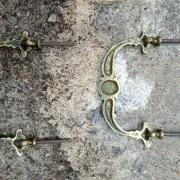 Pair of bronze furniture handles with a mask design, 19th century.