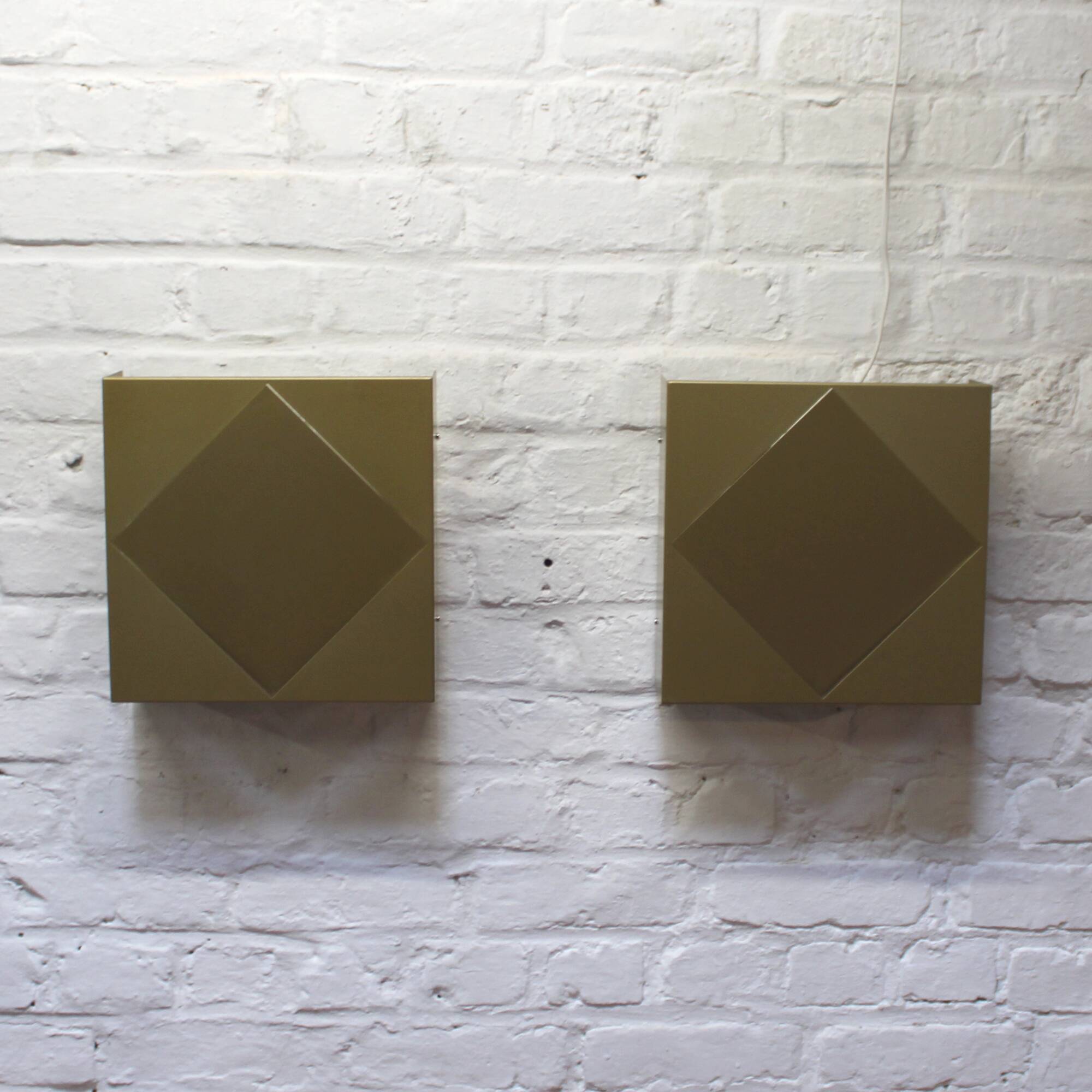 Pair of vintage Raak golden wall lights model 1556