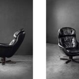 Vintage black leather swivel chair in mid-century modern Scandinavian style.