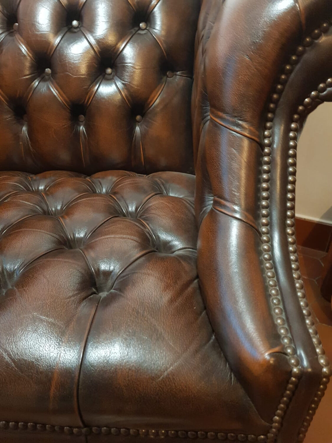 Pair of leather Chesterfield armchairs