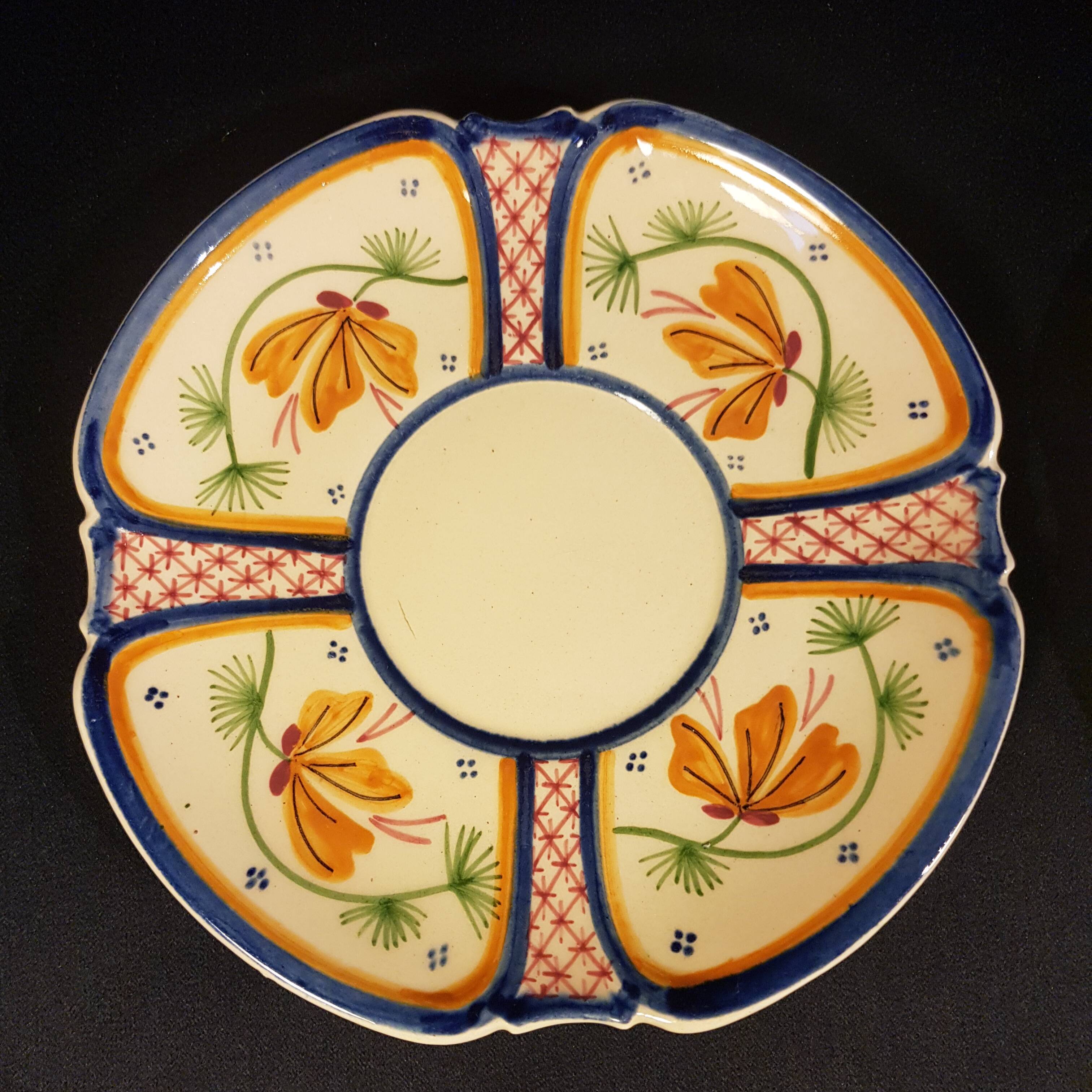 4 Quimper earthenware saucers or plates