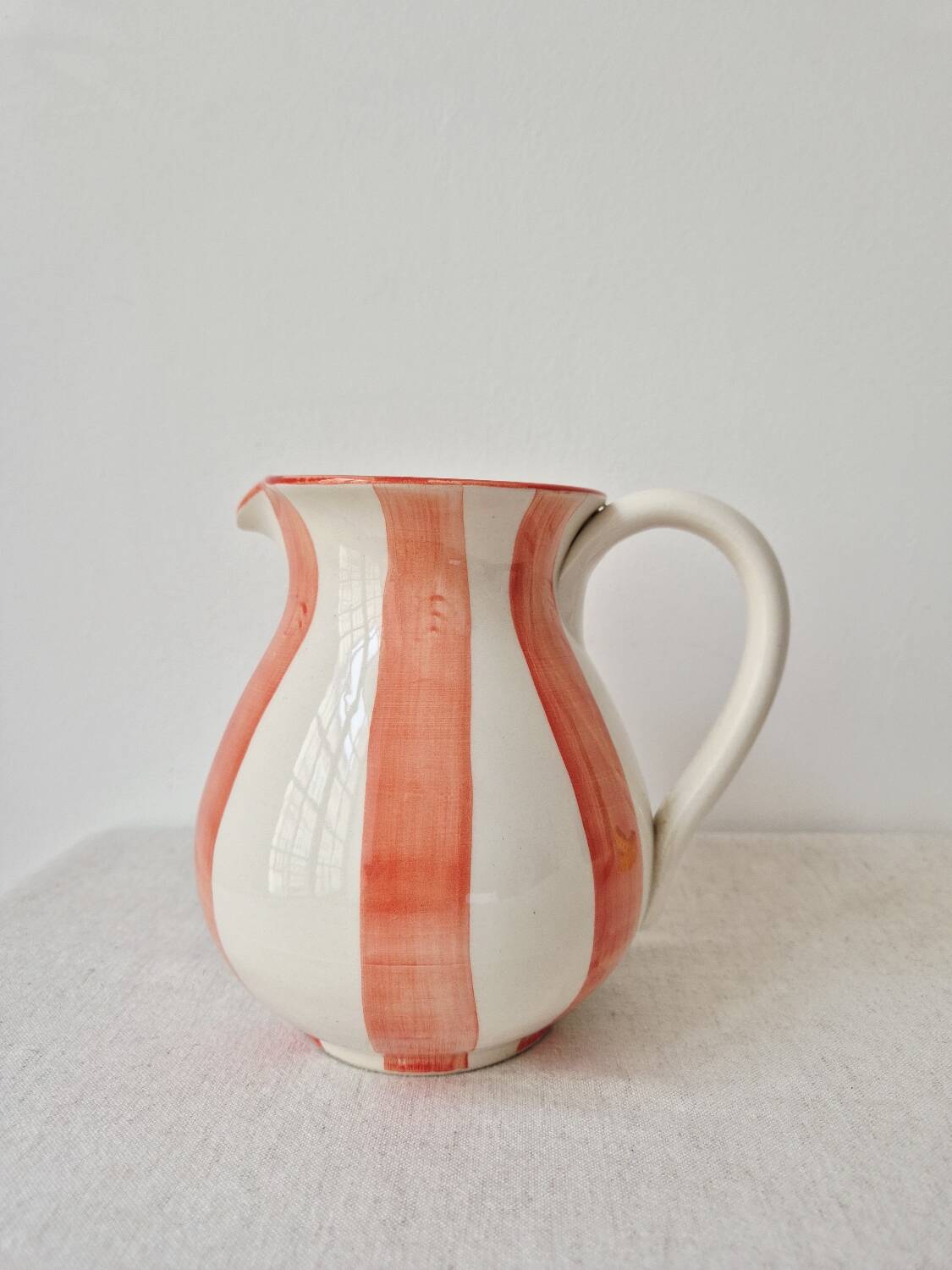 Vintage ceramic vase/pitcher with handmade mandarin stripes.
