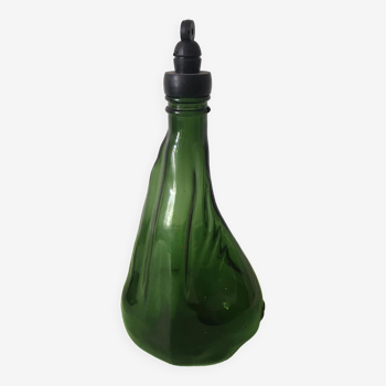 Atypical shaped bottle in green glass and black plastic screw cap. banyuls brand