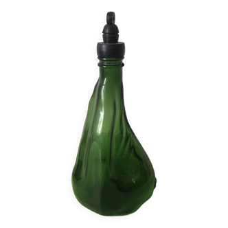 Atypical shaped bottle in green glass and black plastic screw cap. banyuls brand