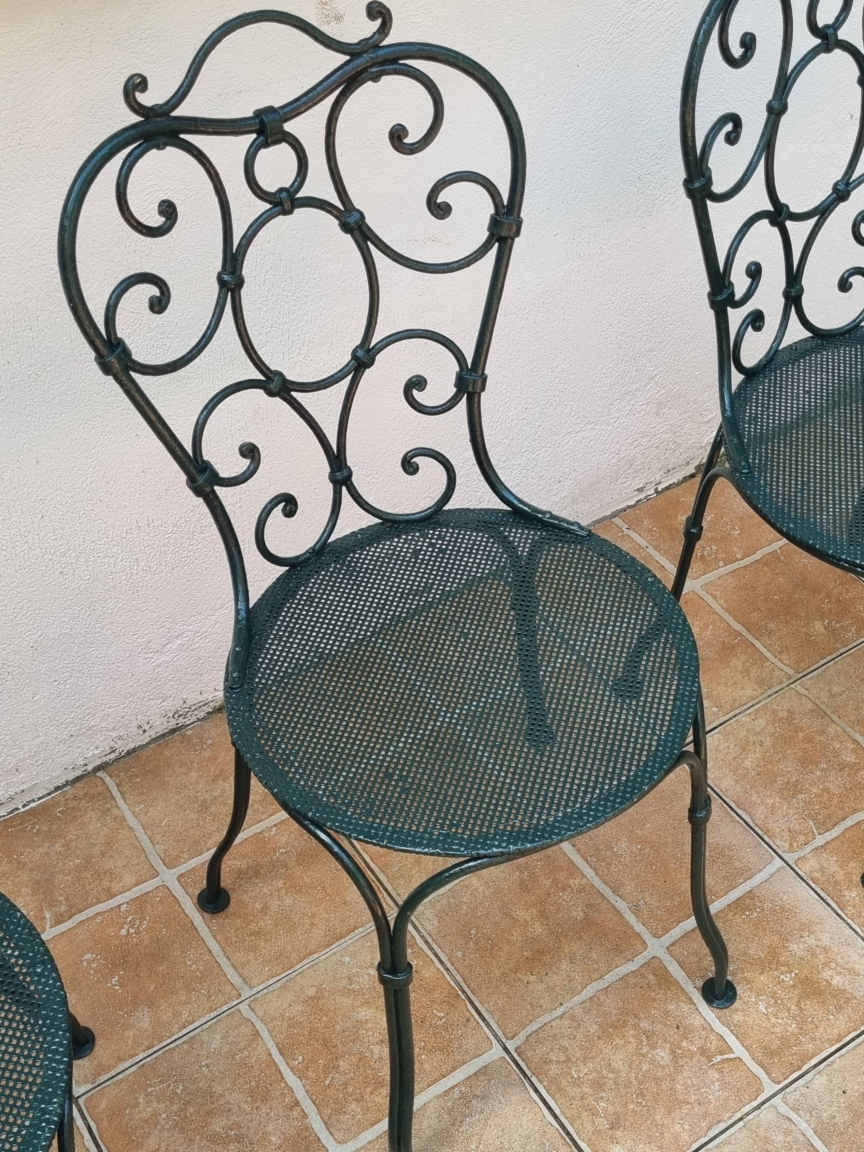Set of 4 antique garden chairs in wrought iron from 1900.