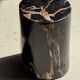 Black petrified wood side table with beige stripes, star pattern H35 D24.