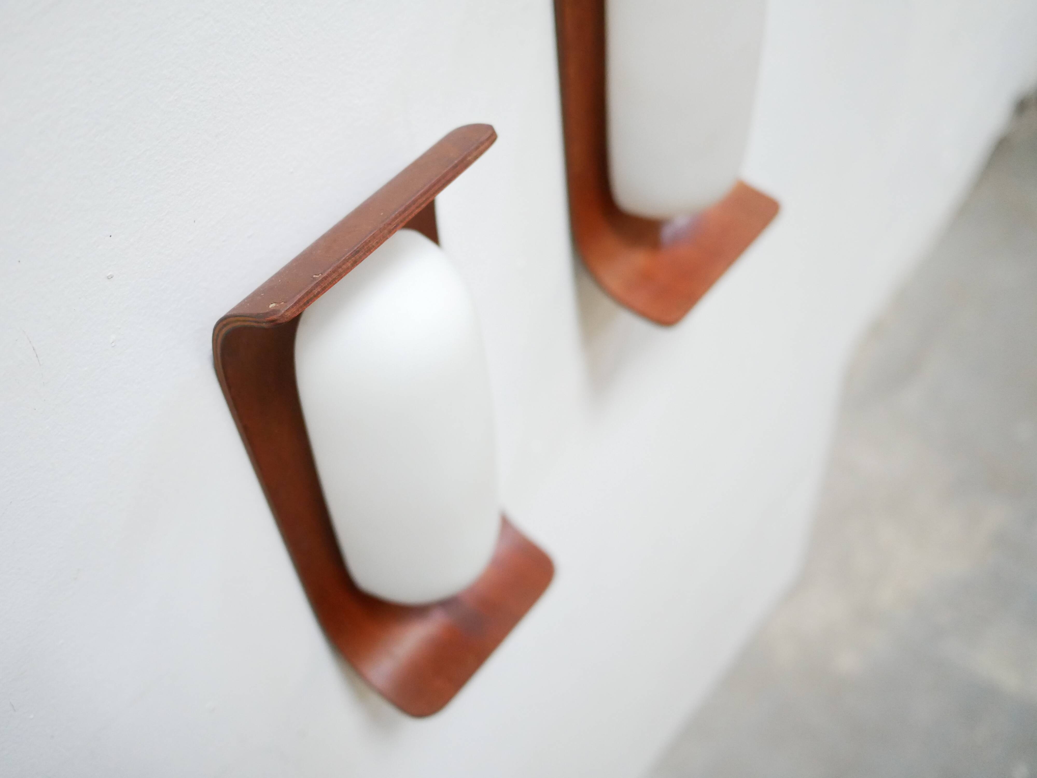 Pair of teak and opaline wall lamps by Goffredo Reggiani