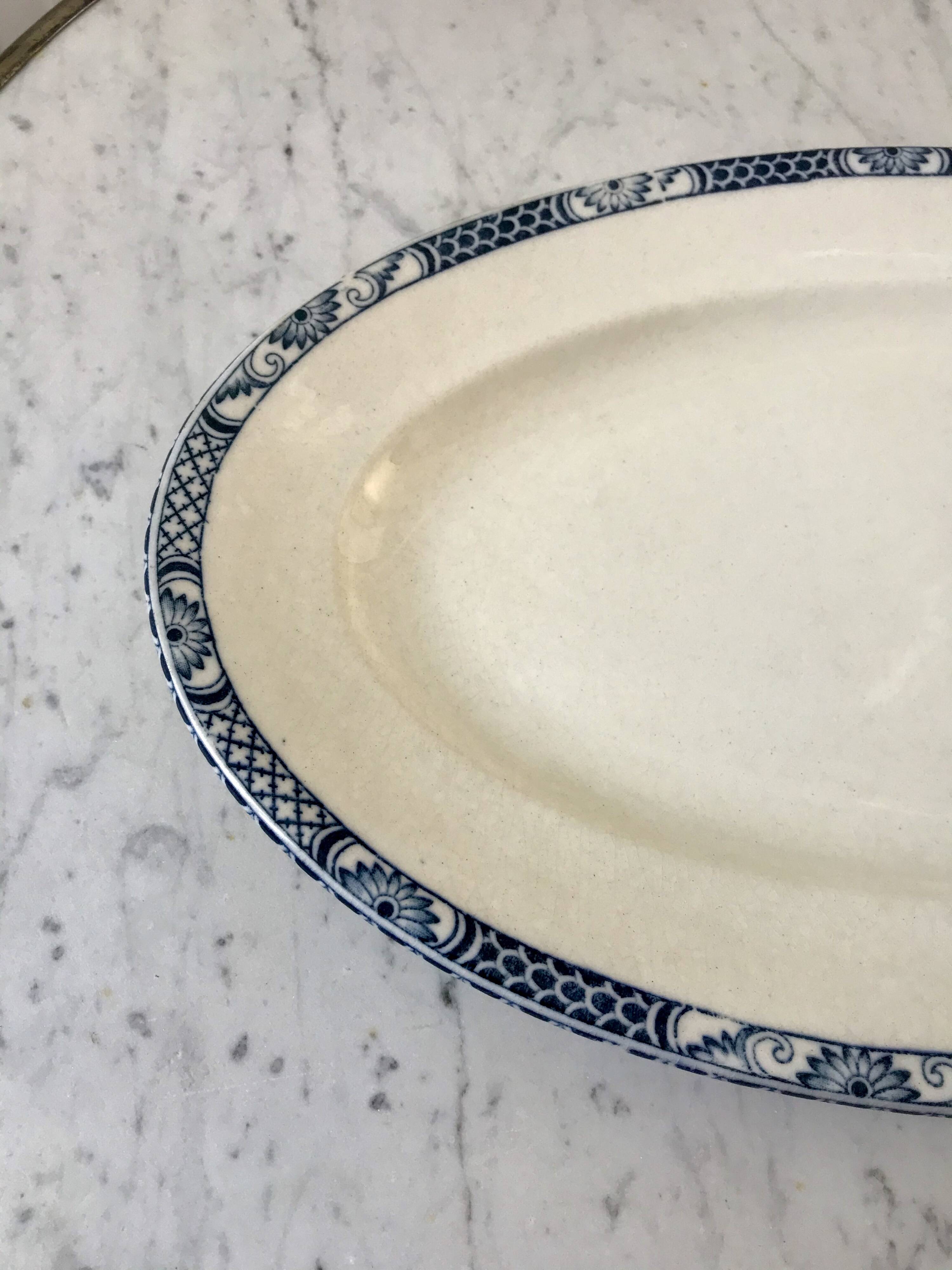 Oval dish in terre de fer bleu xixth