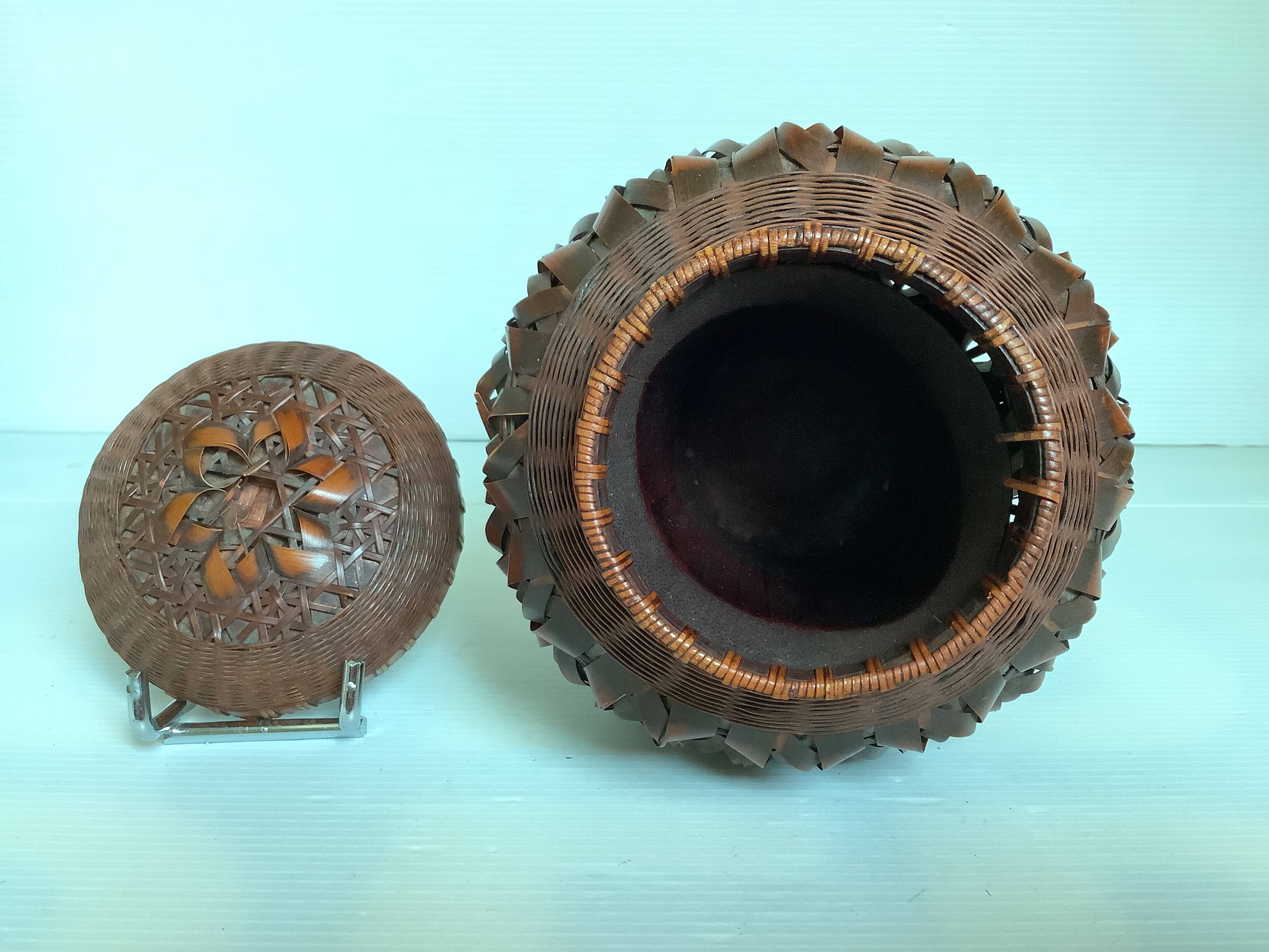 Covered wooden vase covered with woven bamboo