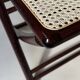 Set de quatre chaises pliantes en bois et cannage