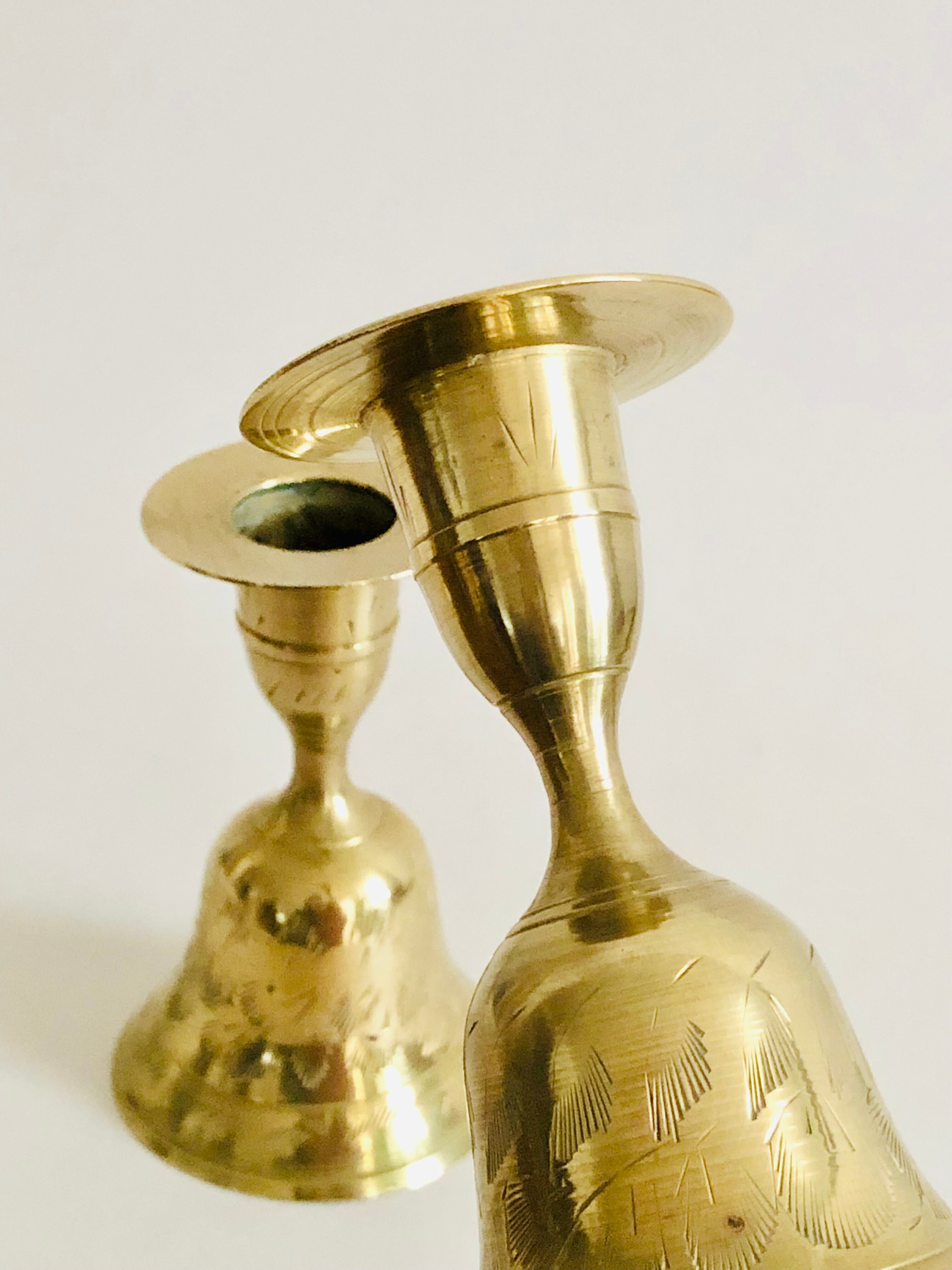 Pair of brass "bell" candle holders