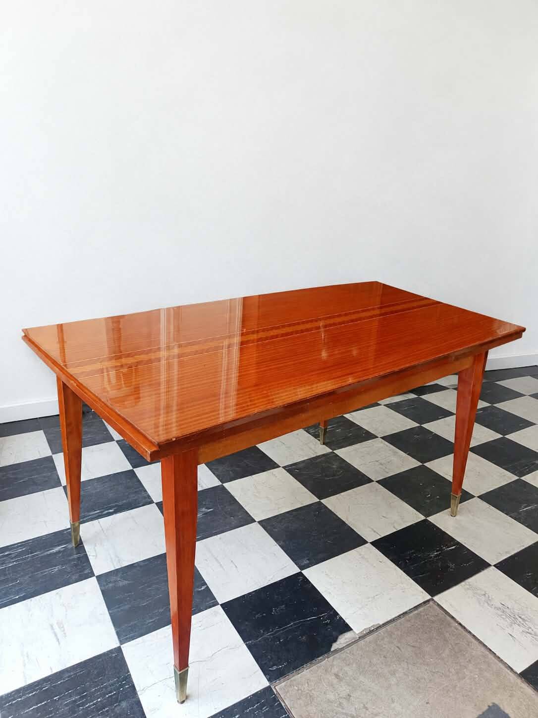 Mid-century vintage coffee table with tapered legs.