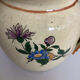 Old ceramic jug with floral decoration