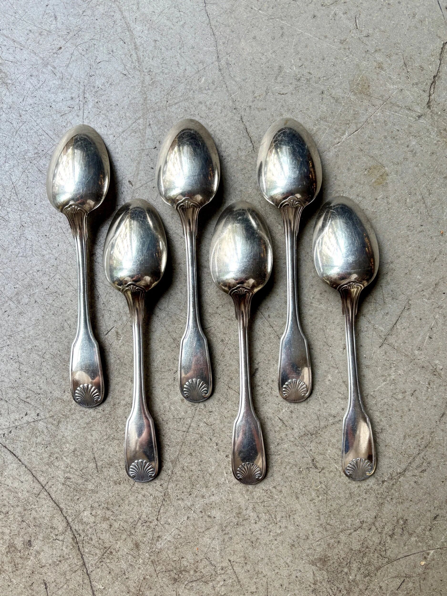 6 large Christofle silver-plated spoons with shell decoration.