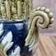Gustave De Bruyne barbotine vase Fives Lille with an old floral decoration and stylised handles.