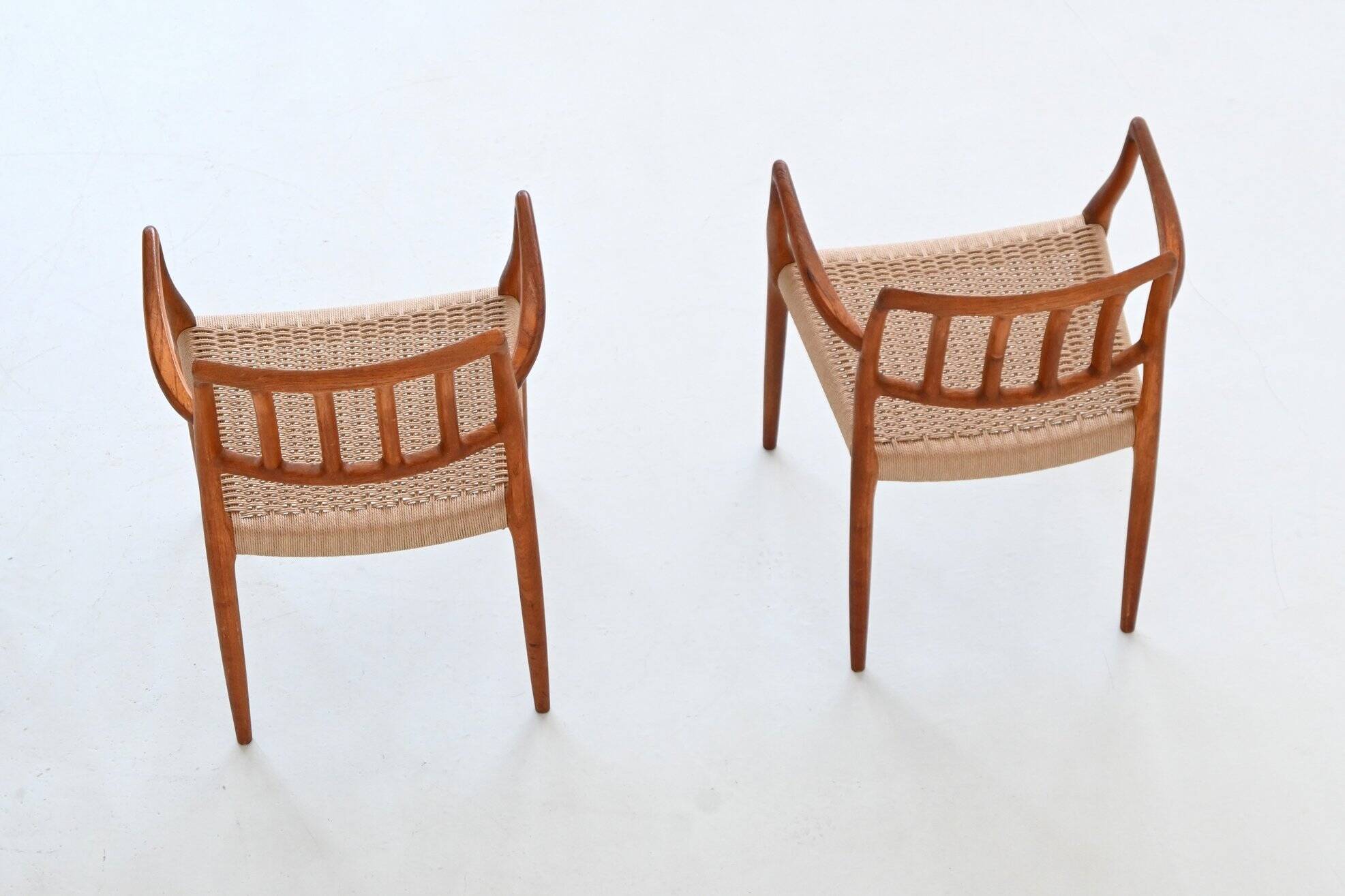 Niels Otto Moller model 66 armchairs teak and paper cord Denmark 1974