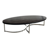 Oval coffee table in chrome and wood, mid-century style.