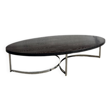 Oval coffee table in chrome and wood, mid-century style.