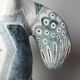 Vintage stylised mermaid ceramic wall sculpture from an art studio.