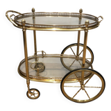 Oval brass trolley from Maison Baguès.