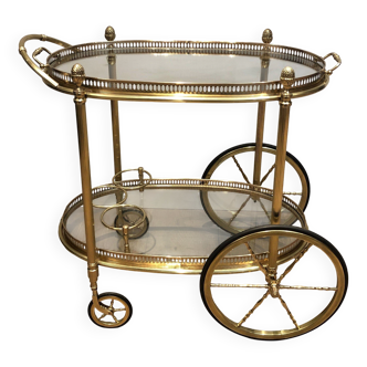 Oval brass trolley from Maison Baguès.