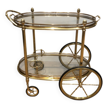 Oval brass trolley from Maison Baguès.