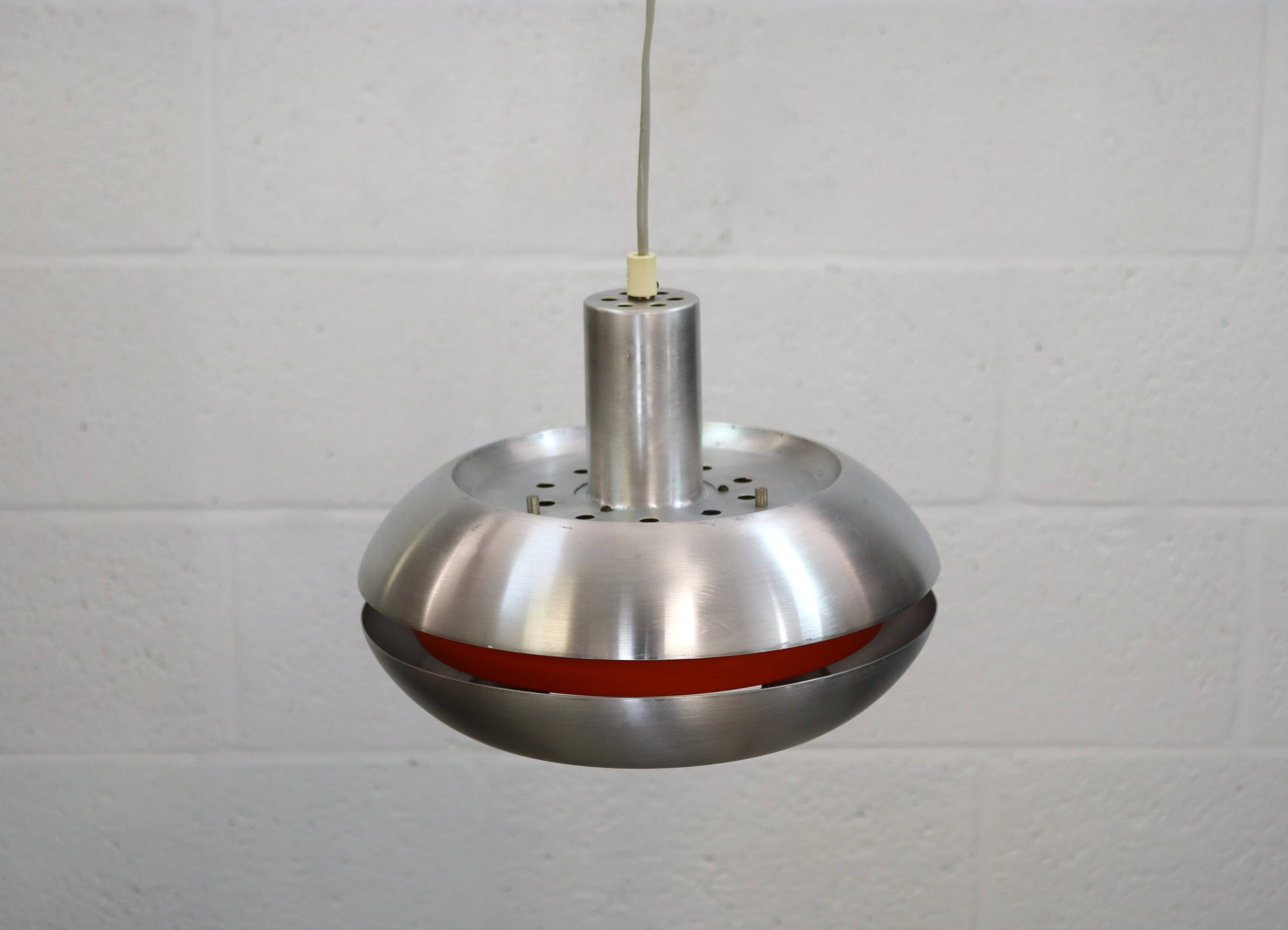Old Danish space age design lamp in alu and orange inside.