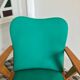 Fauteuil vintage bois et skaï vert