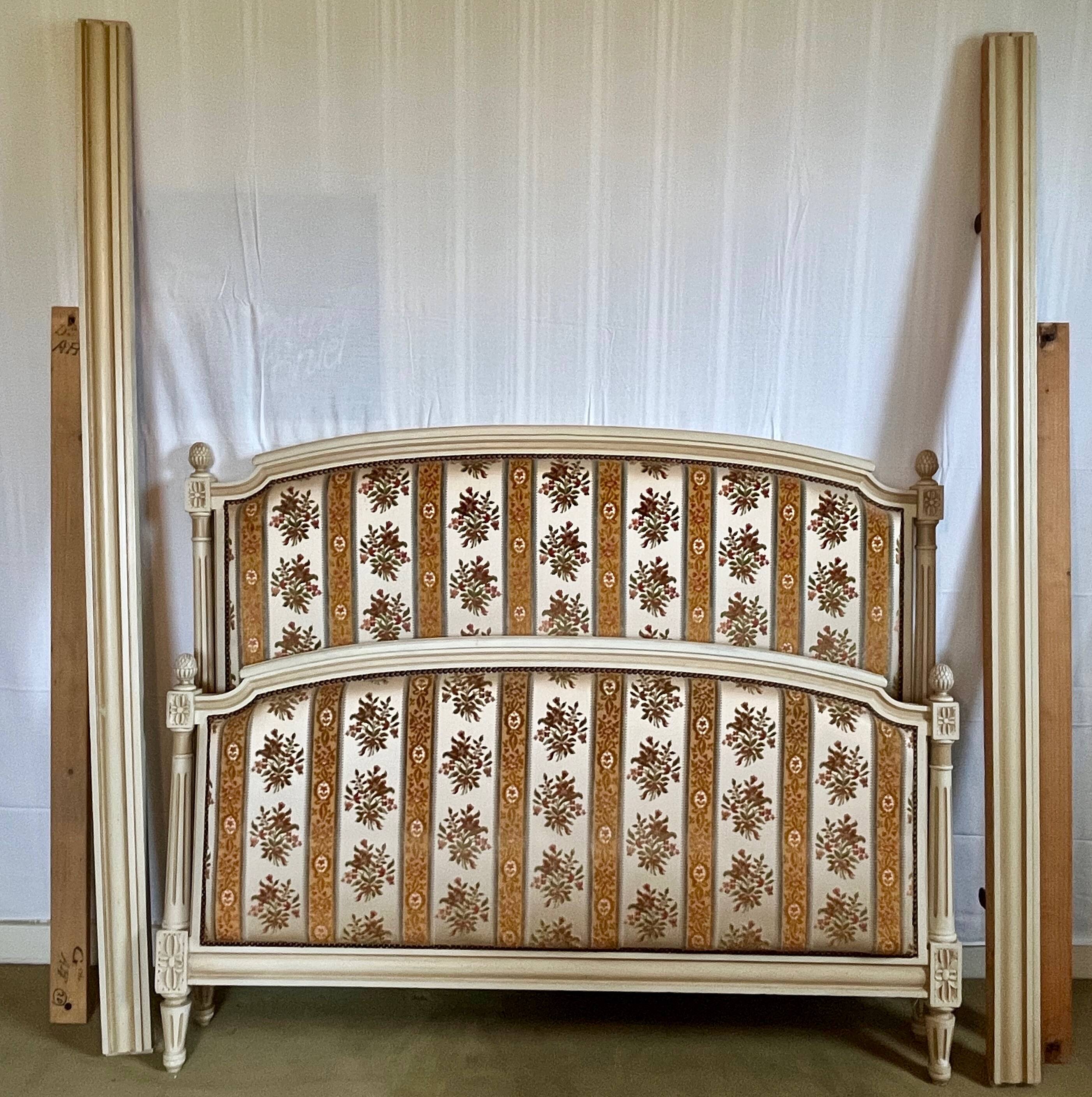 Louis XVI style bed in patinated wood with fluted columns.