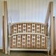 Louis XVI style bed in patinated wood with fluted columns.