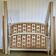 Louis XVI style bed in patinated wood with fluted columns.