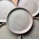 Set of 12 large and 11 small sandstone plates