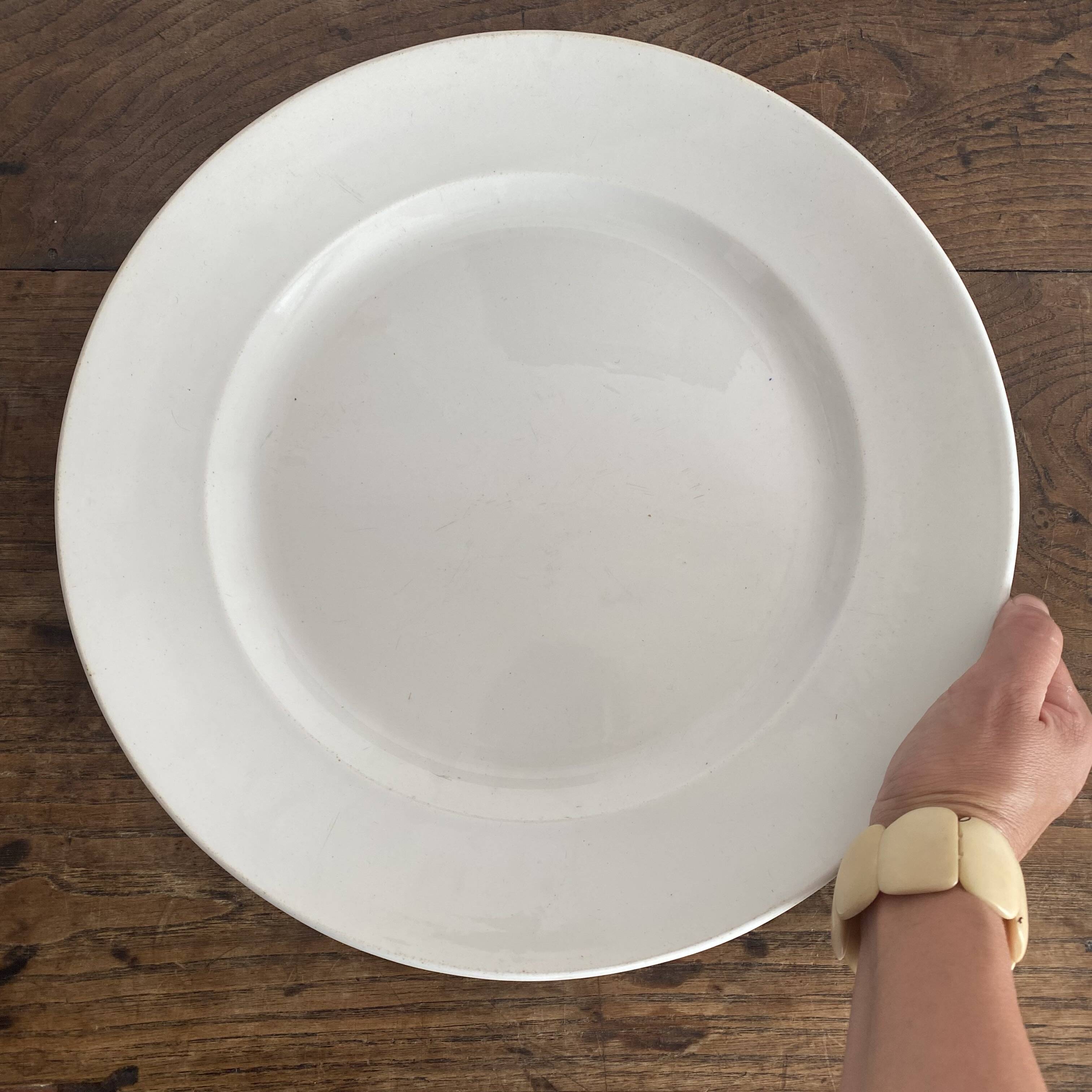 Set of large round white earthenware dishes from Creil and Montereau, 19th century