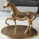 Large vintage horse in exercise figurine on oval base, in polished brass 26 x 19 cm