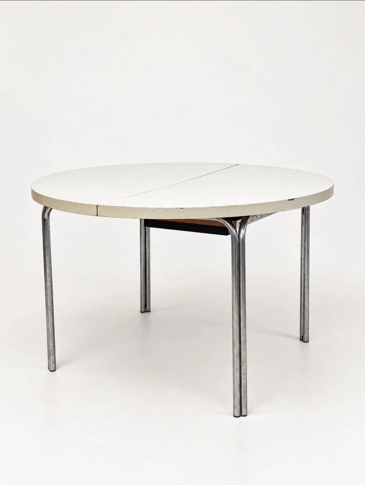 Vintage round extendable dining table, white laminate on chrome legs.