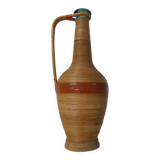Old bottle dressed in vintage wood rattan