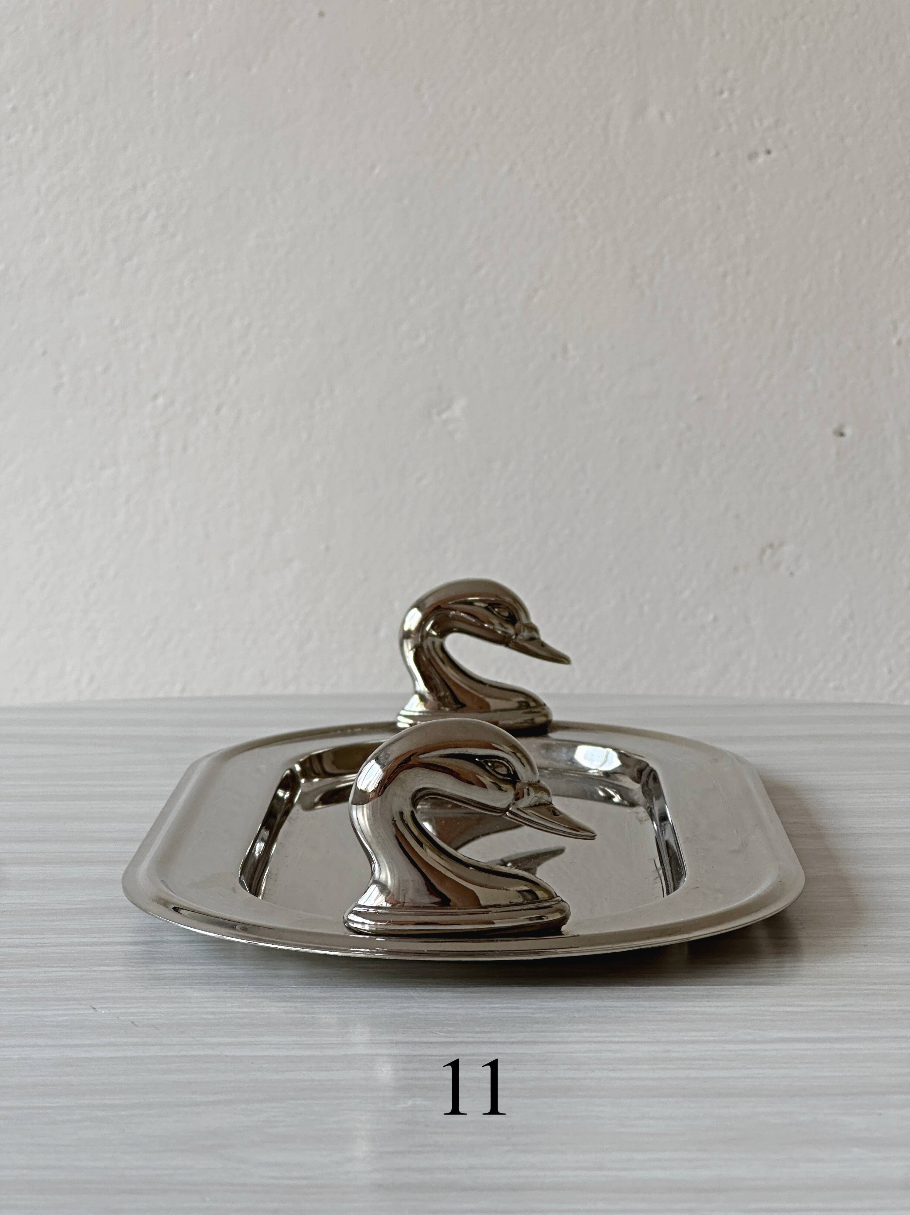 Metal dish with goose head handles serving tray