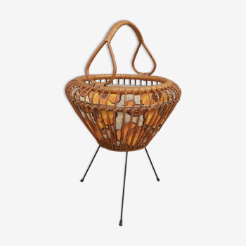 Vintage rattan sewing basket on metal base