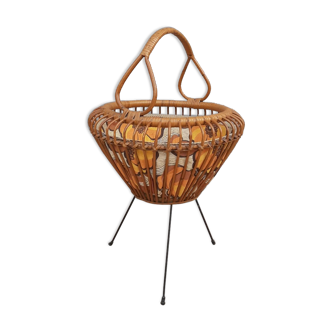 Vintage rattan sewing basket on metal base