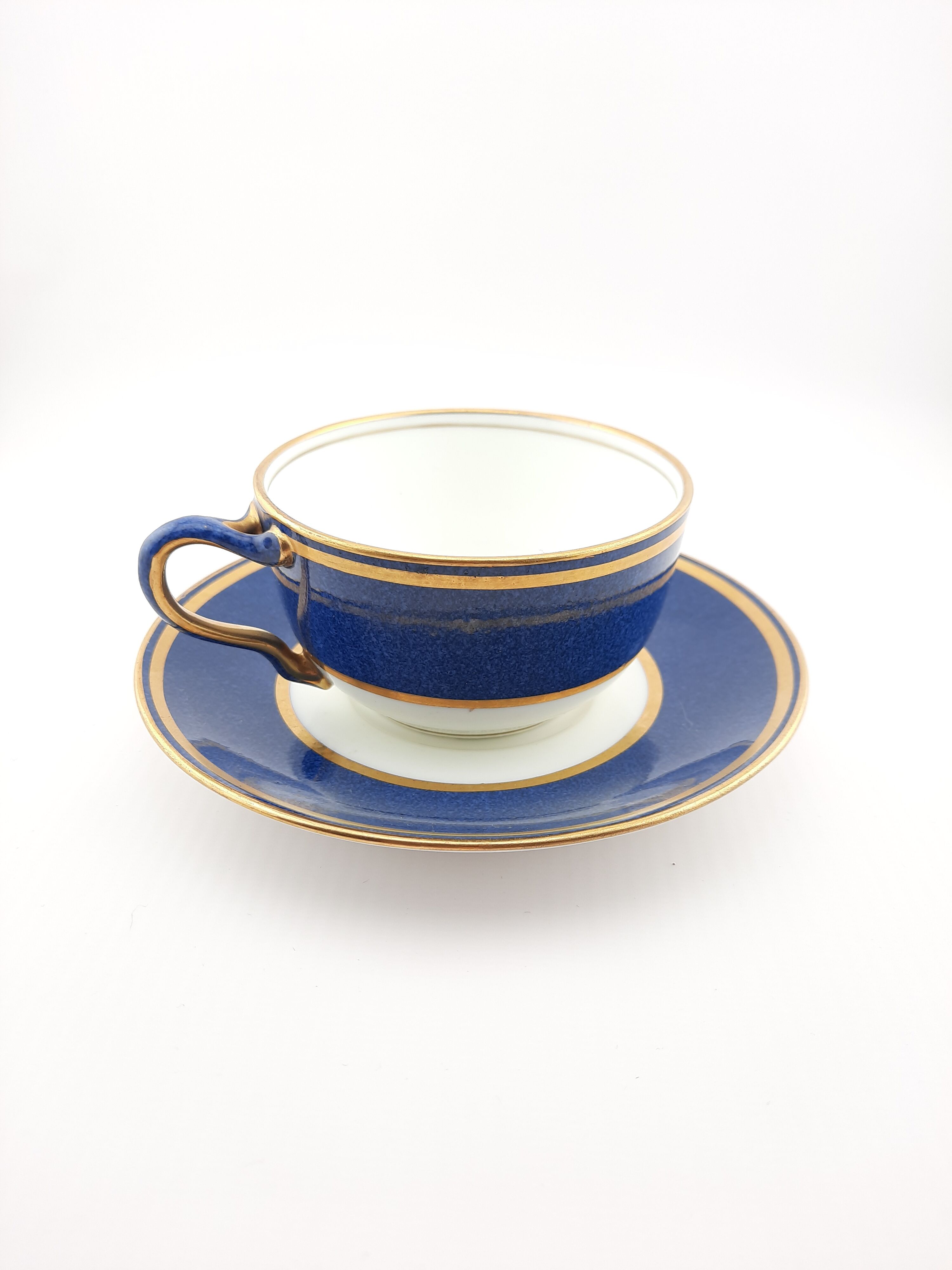 Antique Wedgwood teacup and saucer, bone china. Powder blue and gold English cup and saucer, 1900s