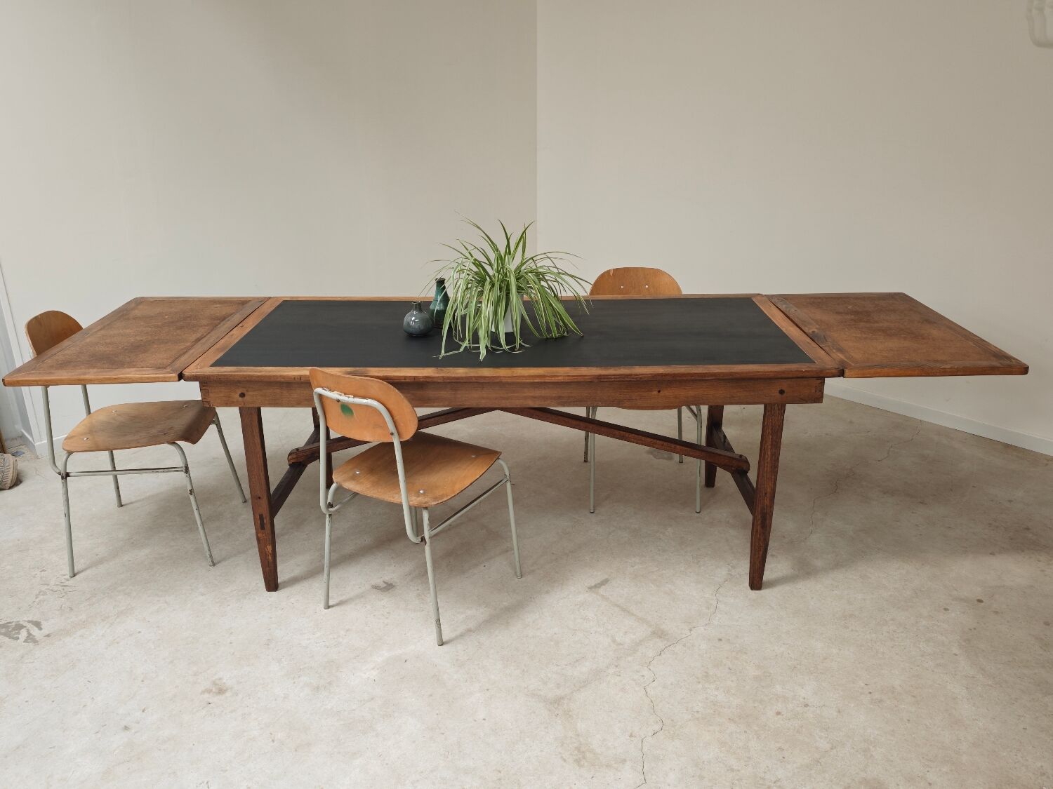 Vintage workshop folding table in oak with a hand-patinated black top.