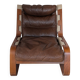 Leather and wood armchair, brutalist style.