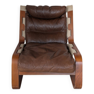 Leather and wood armchair, brutalist style.