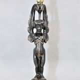 Pair of candle holders in gilded bronze and patinated with a candle